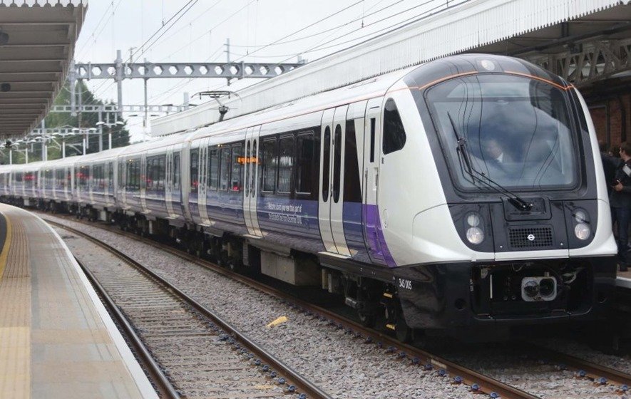 Train on the Elizabeth Line in central London, symbolizing how 2.5 trips cover a 10-mile distance underground.