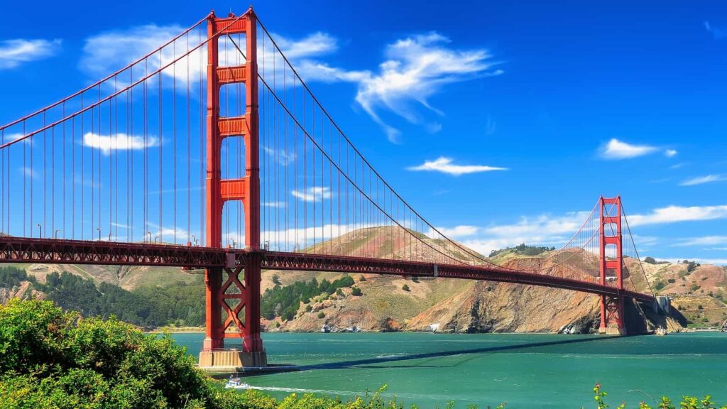 Golden Gate Bridge stretching across San Francisco Bay, visualizing six bridges laid end-to-end to represent a 10-mile span.