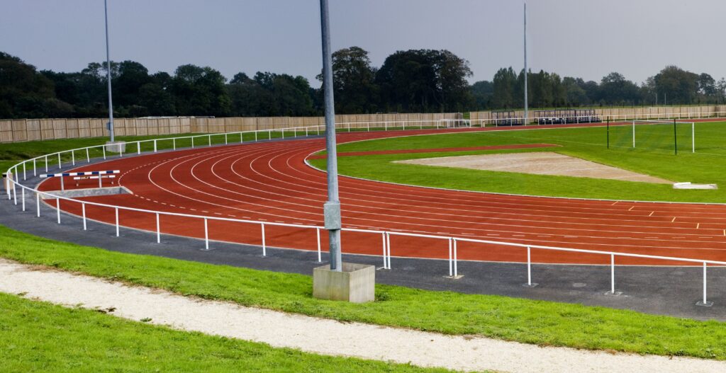 standard running track with lanes, representing a 10-mile run as 40 laps around the track.